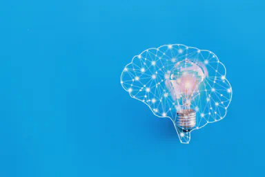 A brain depicted as a network generating an idea