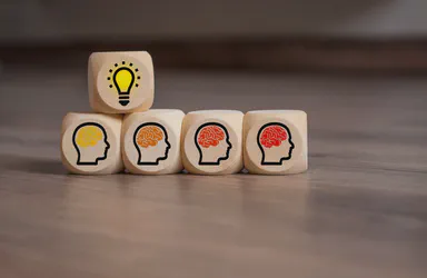 Wooden blocks depicting a creative team
